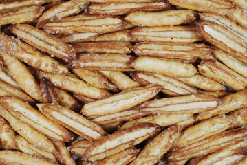 custard cookies in the form of sticks with sugar spread on the surface