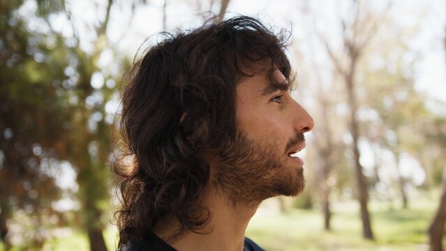 Long Hair Man Astonished To Read An Incomprehensible Poster On The Street
