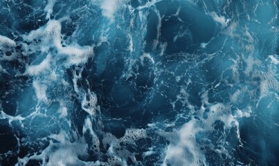Obraz premium Chaotic blue ocean waves crashing, foamy water in constant motion.