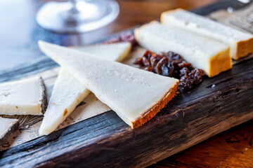 Tasting of Spanish cheeses made on Canary islands, goat cheese, smoked and triangles of manchego...