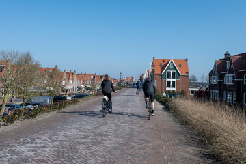Tourists destination in North Holland, old authentic fishermen village Volendam near Amsterdam with old houses and narrow streets