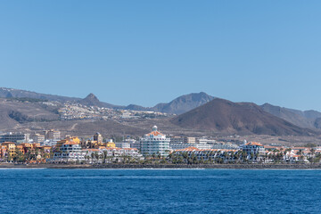 Fototapeta premium Hotels, resorts, beaches on South of Tenerife in Costa Adeje and Playa de las Americas, Canary islands, Spain in winter, view from ocean