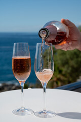 Celebration, birthday party, drinking of rose cava or champagne sparkling wine in vacation resort Costa Adeje, Tenerife, Canary islands winter sun vacation, Spain