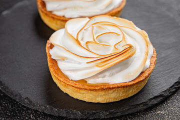 Lemon tart sweet dessert meringue, lemon curd tasty fresh gourmet food background table rustic food...