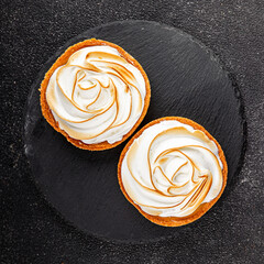 Lemon tart sweet dessert meringue, lemon curd tasty fresh gourmet food background table rustic food...