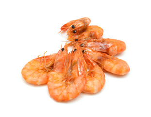 Stack cooked unshelled tiger shrimps isolated on white