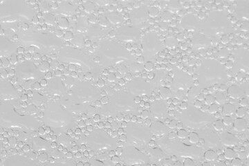 White gray background of water drops from the cold ice in the frozen. Soft blurred texture background.