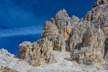 Dolomite Alps mountains in Europe beautiful landscape photo. Stunning rocky peaks of Dolomiti Alps under clear blue sky cliffs and climbing walls of European Alps scenic view