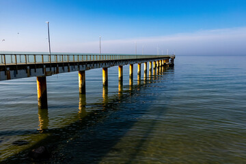 Fototapeta premium Zelenogradsk, Russia. March 08, 2025 Pier on the Baltic Sea