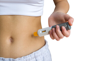 Young woman giving an self injection in the stomach