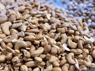 The choicest delicious raw cashews nuts are sold in large quantities at the local nut market. Close-up