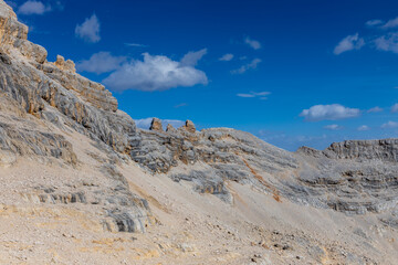 Dolomite Alps mountains in Europe beautiful landscape photo. Stunning rocky peaks of Dolomiti Alps under clear blue sky cliffs and climbing walls of European Alps scenic view