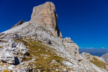 Dolomite Alps mountains in Europe beautiful landscape photo. Stunning rocky peaks of Dolomiti Alps under clear blue sky cliffs and climbing walls of European Alps scenic view