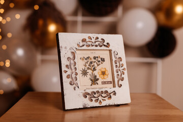 A beautifully crafted wooden frame with intricate carvings, perfect for elegant home decor.