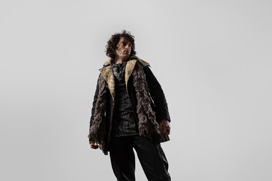 A dramatic hero from the post-apocalypse, a young man in mud and dirty clothes, a daring survivalist