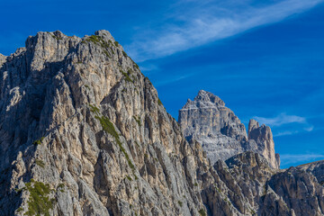 Dolomite Alps mountains in Europe beautiful landscape photo. Stunning rocky peaks of Dolomiti Alps under clear blue sky cliffs and climbing walls of European Alps scenic view