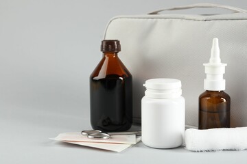 First aid kit. Different medical supplies on light grey background, closeup. Space for text