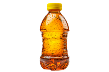 Orange liquid in a bottle with yellow cap, wet condensation, cut out transparent