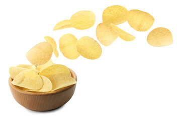 Tasty potato chips falling into bowl on white background