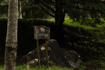 A rustic wooden sign reading 