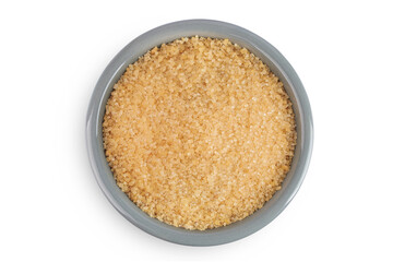The brown sugar in ceramic bowl isolated on white background. Top view. Flat lay
