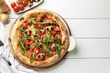 Tasty pizza with mushrooms, tomatoes, arugula and server on white wooden table, flat lay. Space for text