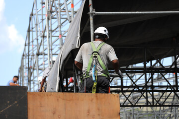 Workers assembling metal structure