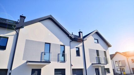 The real estate market in the suburbs. New single family houses in a new development area....