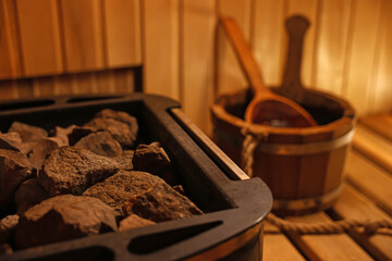 Stove with hot rocks in sauna, closeup