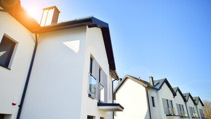The real estate market in the suburbs. New single family houses in a new development area....
