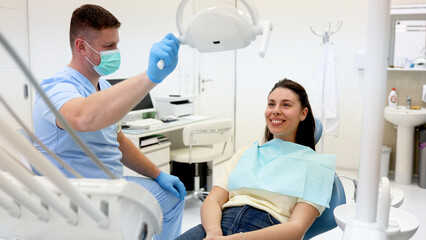 Fototapeta premium Young woman sitting on a dental chair