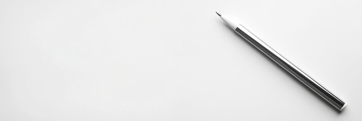 Naklejka premium A pen rests on a wooden table, showcasing its sleek design and functional elegance.