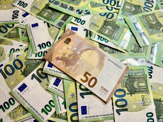 Euro banknotes background, hundred euro cash and one 50 euro banknote