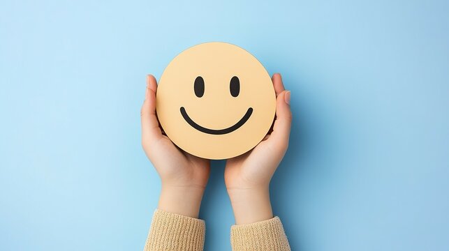 A Person Holding a Smiling Face Emoji Symbol