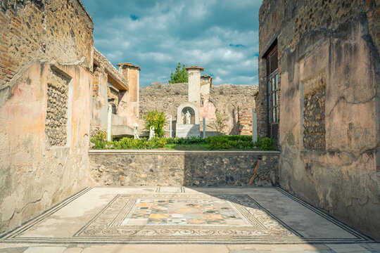 Ancient Interior Courtyard Mosaic in Pompeii, Italy, Under Clear Skies