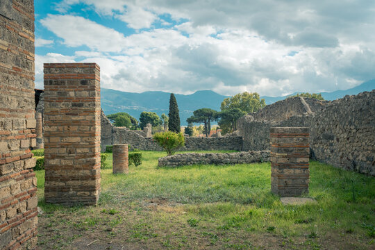 Ancient Ruins in Pompeii With Pillars and Scenic Mountain View