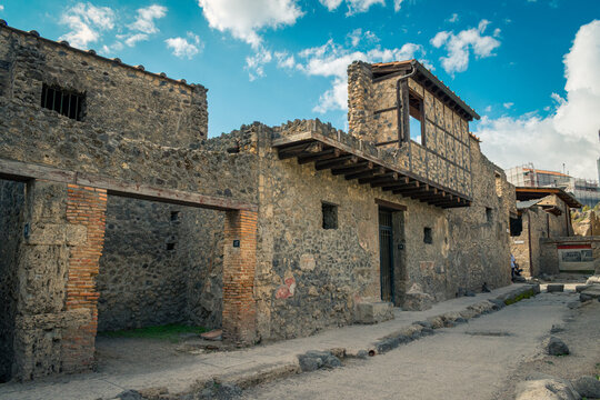 Ancient Stone Ruins of Pompeii Under a Bright Blue Sky