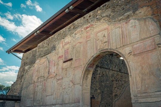 Ancient Roman Wall with Frescoes in Pompeii, Italy on a Sunny Day