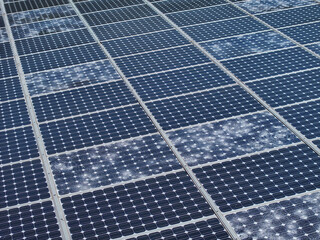 AERIAL, CLOSE UP: Shattered and cracked photovoltaic cells damaged by a hailstorm. Fractured glass...