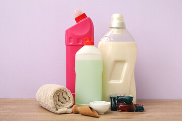 Set of cleaning supplies on wooden table