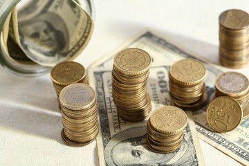 Golden coins with dollars on grunge beige background