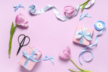 Frame made of gift boxes with tulips, ribbon and scissors on lilac background. International Women's Day