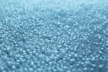 Refreshing soda water as background, closeup view