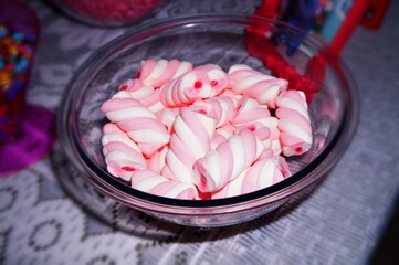 Marshmallow Twist of pink, white color in a glass bowl