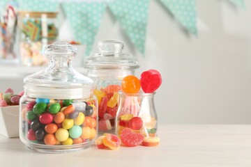 Candy bar. Many different sweets on white table indoors, closeup. Space for text