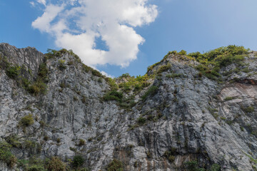 A rocky cliff under a blue sky