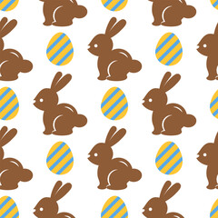 Easter seamless pattern with chocolate bunnies and yellow eggs on a white background. Pastel pattern with Easter rabbits. Cute background for greeting cards, baby textiles, wallpapers