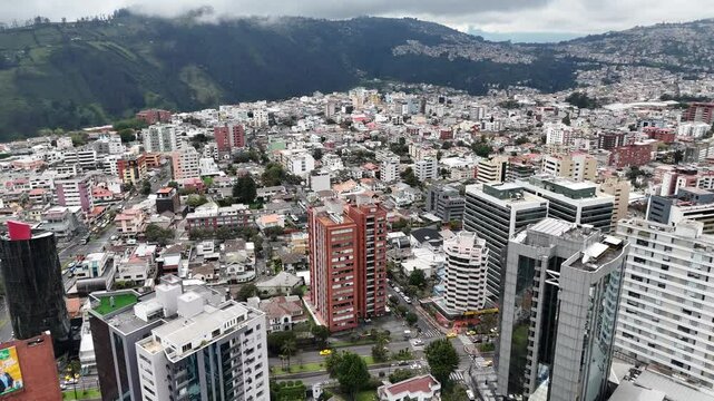 Aerial footage of the city Quito in Ecuador with the Volcan mountain on background