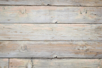 Obraz premium Weathered wooden planks create a rustic backdrop in natural light
