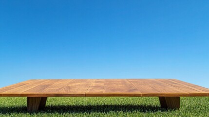 Fototapeta premium Vibrant Green Grass Under a Clear Blue Sky with Wooden Platform